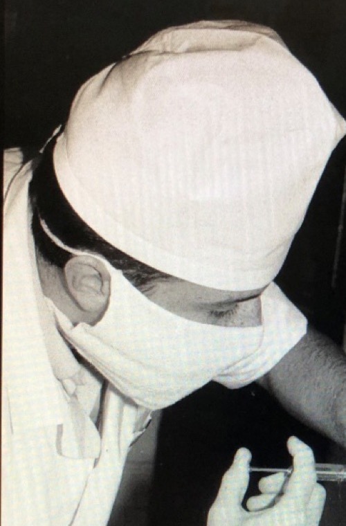 Black and white photograph of the young Dr. Kaplansky at work in Siberia, 1991