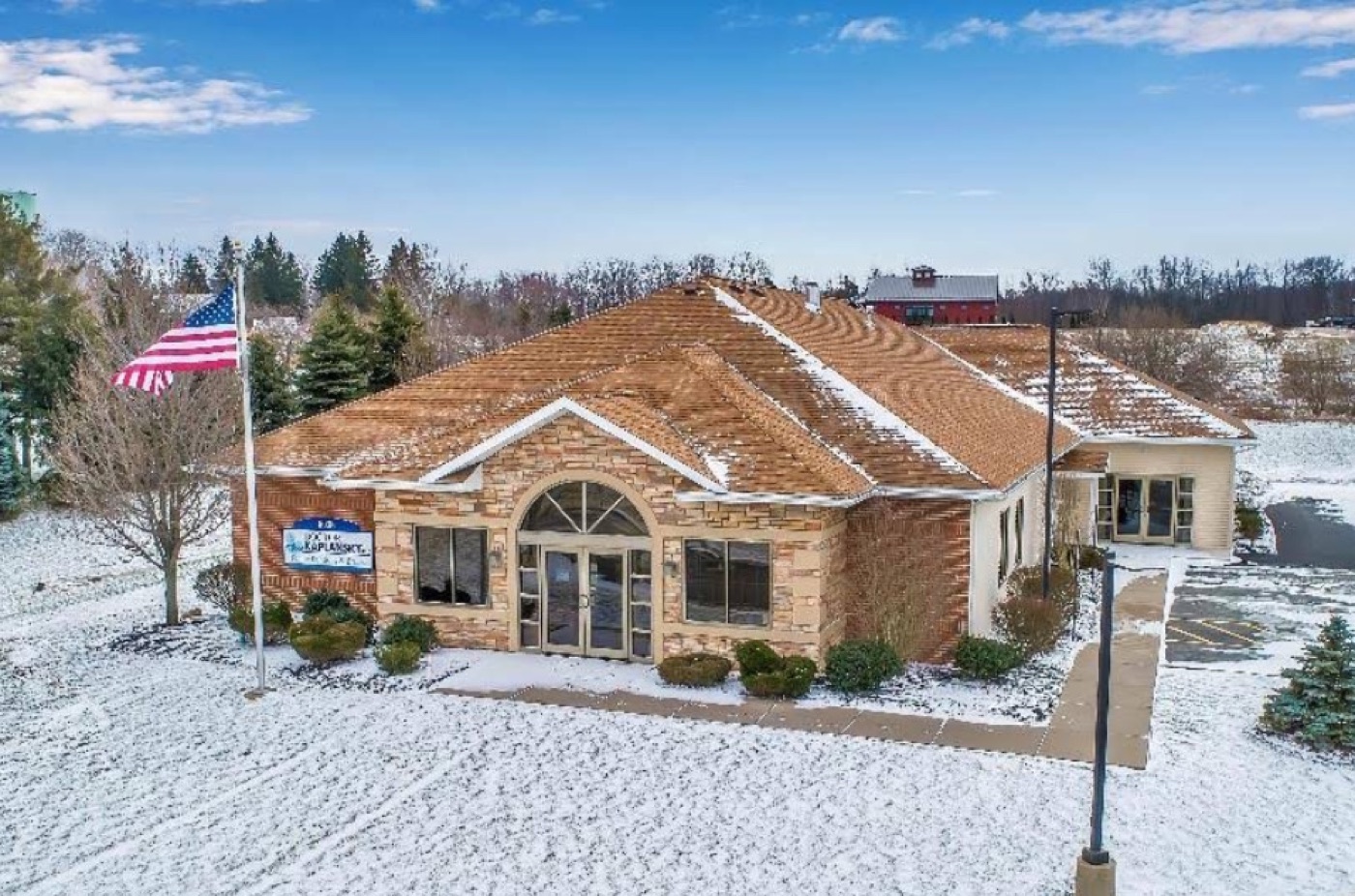 The Dentistry by Dr. Kaplansky building in Gasport, New York, in winter